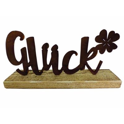 Schriftzug "Glück" auf Holzsockel